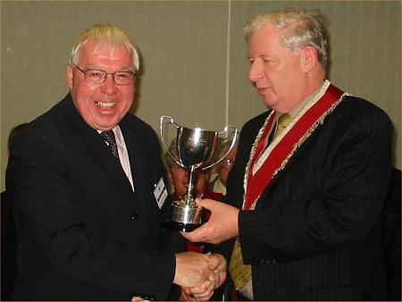 Dennis Donnelly receiving Joe Reilly Cup. Pic:DStockdale
