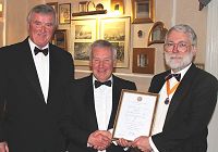 Tim Boyes receives his 40 year scroll. Pic:BS